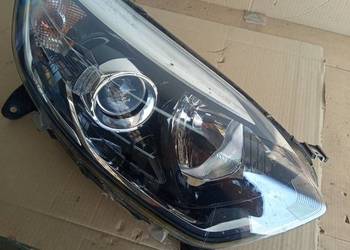 Reflektor prawy renault kaptur orginalny
