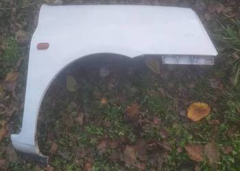 Blotnik przód prawy  RENAULT  CLIO II lift  biały bez malowa