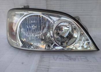 Kia Carnival 1 I lampa przednia prawa reflektor przód
