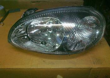 DAEWOO LANOS REFLEKTOR H4 LE/PR ELE. REG. CZAR. OBUD.