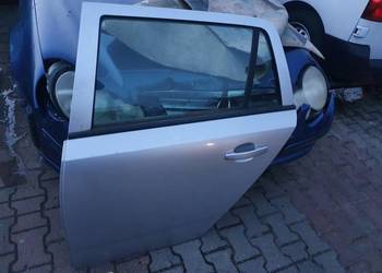 DRZWI LEWY TYŁ OPEL ASTRA III H KOMBI SREBRNE
