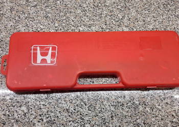 Trójkąt ostrzegawczy Honda z walizką