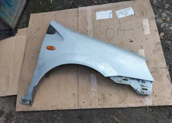 NISSAN ALMERA TINO BŁOTNIK PRAWY PRZÓD