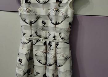 Elegancka wseslna sukienka rozmiar 146
