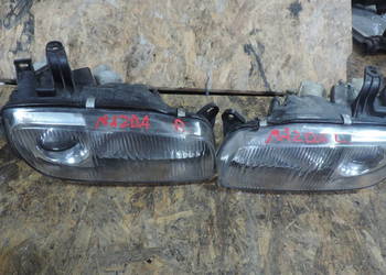 MAZDA 323F BA REFLEKTOR LAMPA PRAWA LEWA  PRZÓD