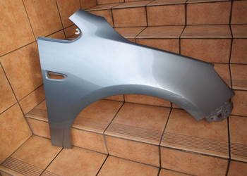 Opel Astra J 4 błotnik prawy przód 2009 - 2015r