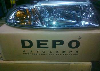 MITS. CARISMA 99/02 REFLEKTOR  LAMPA ELE. NOWY DEPO  PR