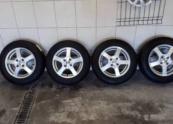 Sprzedam felgi aluminiowe z oponami 4x100R14, stan b.dobry.