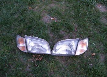 Reflektor przedni przód lampa Mitsubishi Space Star I szklany