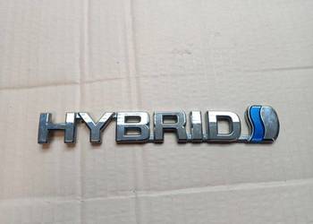 TOYOTA AURIS II 2012- ZNACZEK EMBLEMAT NAPIS BŁOTNIKA HYBRID 75374-12010