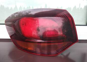 Opel Astra J kombi lampa tył tylna lewa narożna w błotnik ciemna