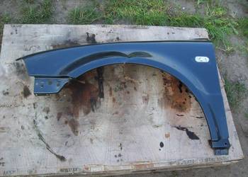 Passat B5 FL Blotnik lewy przod przedni LC7U Oryginal