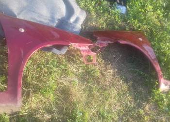 Błotnik przedni prawy lewy przód Fiat Punto II lift 03- bordowy 3 drzwi