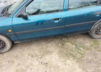 LISTWY LISTWA  BOCZNE BŁOTNIKA DRZWI  FORD MONDEO MK1