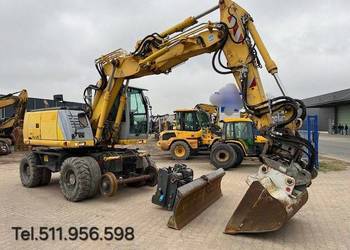 Koparka kolowa kolejowa New Holland MH plus2