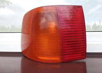 Audi 100 C4 lampa tył tylna lewa narożna w błotnik Hella wkład oprawka