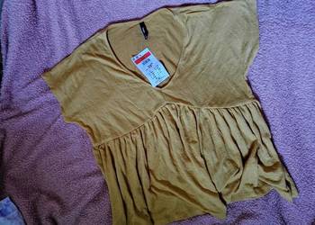Nowa z metką! Bluzka  Z teksturowanego materiału. Dobra na rozmiary: xs S m