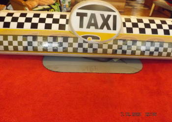 Sprzedam transparent TAXI(kogut) w b. dobrym stanie