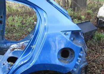 ĆWIARTKA BŁOTNIK LEWY TYŁ 44J MAZDA 2 DJ