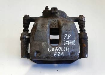 Toyota Corolla XII E21 PRZEDNI ZACISK HAMULCOWY prawy przód PASAŻERA P.P