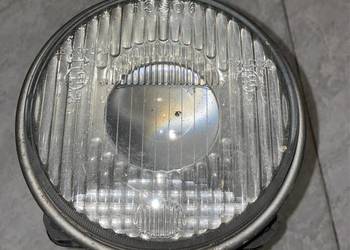 Reflektor lewy lewa BMW E30, uszkodzony zaczep