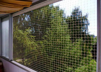 Montowanie siatki na balkon dla kota Warszawa siatka dla kota na balkon