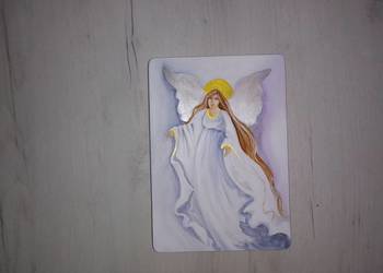 Anioł stróż malowany na desce