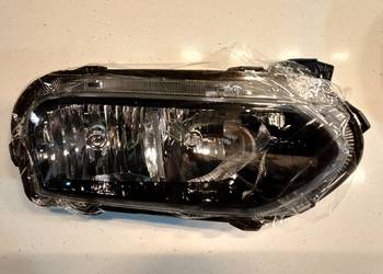 Fabrycznie nowy prawy reflektor Dacia Spring. Światła mijania i drogowe.