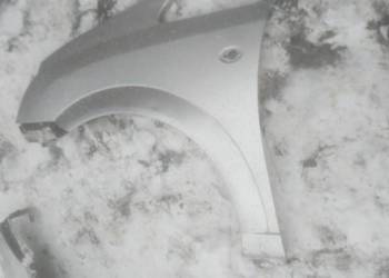 Blotnik przód lewy OPEL  MERIVA srebrny