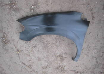 Błotnik przedni lewy przód Chrysler Voyager Dodge Caravan 00-06