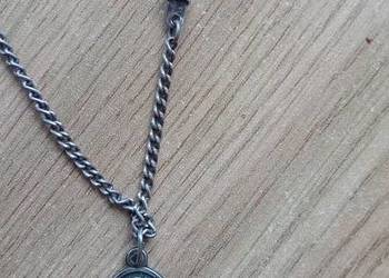 Medalik srebrny z matką boską.