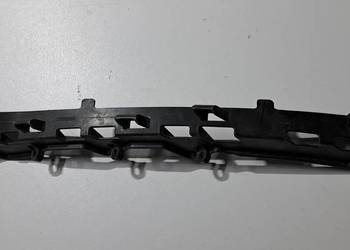 Ślizg mocowania reflektora lewy 1305553007 VW Sharan Seat Alhambra