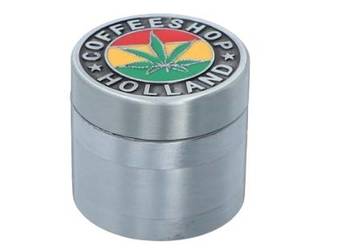 Młynek z Napisem COFFE SHOP HOLLAND i Liściem Marychy na Tle Kolory Reggae