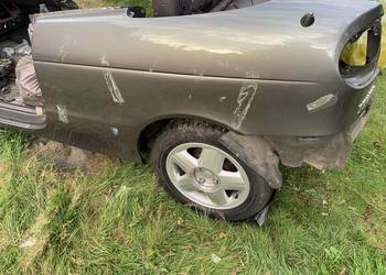RENAULT MEGANE I CABRIO BŁOTNIK LEWY TYŁ