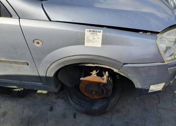 BŁOTNIK PRAWY PRZÓD OPEL CORSA C L163