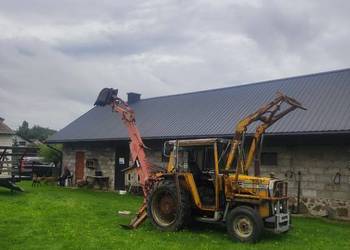 Massey Ferguson 550 koparką zawieszaną i ładowaczem czołowym