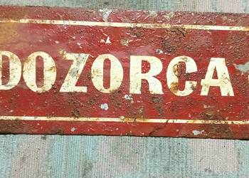 Tabliczka informacyjna dozorca