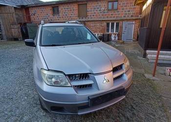 Mitsubishi Outlander 03-08 lampy maska błotniki zderzak przód A31 X42