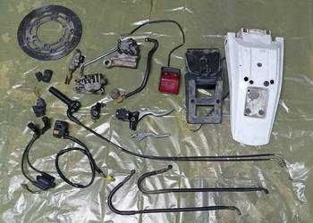 Błotnik lampa cewka WN linka rolgaz pompa zacisk Części Suzuki DR 650 SE