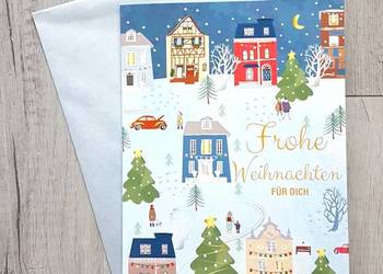 Kartka grająca bożonarodzeniowe z muzyką z kopertą Wesołych Świąt.