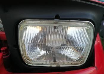 Reflektor Koito Japan lewy Mazda 323F 96r