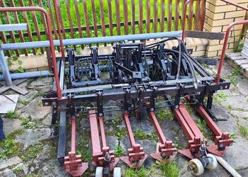 Optimas urządzenie do mechanicznego układania kostki współpraca z koparką