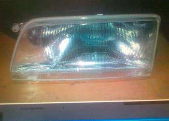 OPEL KADETT E REFLEKTOR + RAMKA MAN. PR..NOWY 316984