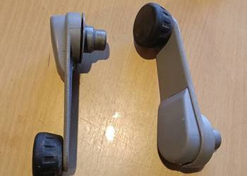 BMW e34.KLAMKA PODNOSNIKA  SZYB