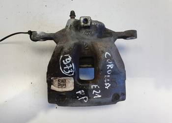Toyota Corolla XII E21 PRZEDNI ZACISK HAMULCOWY prawy przód PASAŻERA P.P