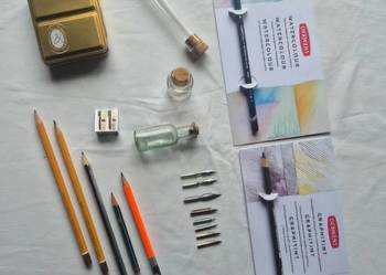 Roman Szmal złoty box kredki akwarelowe stalówki itd