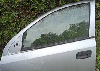 Opel Astra 2 G drzwi przednie lewe srebrne.