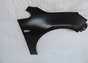 Błotnik przedni prawy OPEL Astry J IV 13390003 NOWY ORYGINAŁ