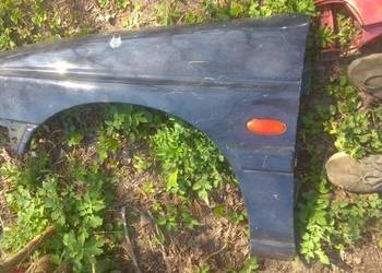 Błotnik przedni lewy FORD ESCORT 95-00 granatowy bez malowan