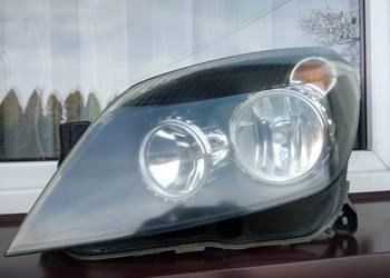 Opel Astra H lampa przednia lewa reflektor przód kierowcy Hella oryginał